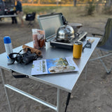 RoofPod Aluminum folding table set up at a camp site