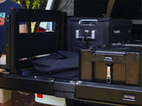 Camping equipment on the Front Runner Cargo Bed Slide / Medium fitted to a Camp4x4 vehicle in the out doors