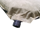 Close-up of a beige MEERKAT Self Inflating Mattress with a black valve connector at the corner, isolated on a white background.