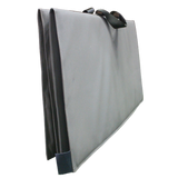 A gray MEERKAT Shooting Mat folded up into a rectangular soft-sided bag or cover with two dark gray handles, viewed from the side, shown against a plain white background.