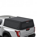 Alu-Cab Contour Canopy for the 2026+ Toyota Hilux Double Cab, mounted on the vehicle, on a white background