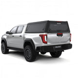 Alu-Cab Contour Canopy for the 2026+ Toyota Hilux Double Cab, mounted on the vehicle, on a white background