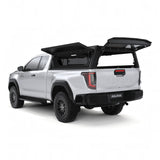 Rear view of the Alu-Cab Contour Canopy for the 2026+ Toyota Hilux Extra Cab, mounted on the vehicle, with the windowless gullwing doors open, on a white background