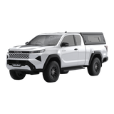 Main view of the Alu-Cab Contour Canopy, with side windows, for the 2026+ Toyota Hilux Extra Cab, mounted on the vehicle, on a white background