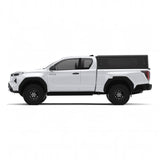 Side view of the Alu-Cab Contour Canopy, with no side windows, for the 2026+ Toyota Hilux Extra Cab, mounted on the vehicle, on a white background