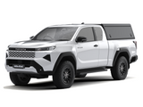 A white Toyota Hilux 2026+ Extra Cab with a Alu-Cab Explorer Canopy, with a smooth finish, over the bed, shown from a three-quarter front angle on a white background.