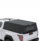 A white Toyota Hilux 2026+ Extra Cab with a Alu-Cab Explorer Canopy, with a smooth finish, over the bed, shown from a three-quarter rear angle on a white background.