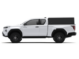 Side view of an Alu-Cab Explorer Canopy, with a smooth finish, on a Toyota Hilux 2026+ Extra Cab on a white background.