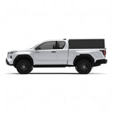 Side view of an Alu-Cab Explorer Canopy, with a smooth finish, on a Toyota Hilux 2026+ Extra Cab on a white background.
