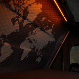 World map onthe inside of the iKAMPER Skycamp 4.0 rooftop tent, and glowing light in the foreground
