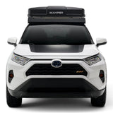 A white Toyota RAV4 SUV shown from the front, featuring a black Hardshell iKAMPER Skycamp 4.0 Trio, 3 sleeper, rooftop tent with an integrated LED light bar mounted on top of the roof rack.