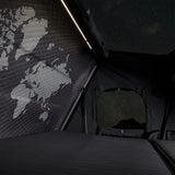 Hardshell iKAMPER Skycamp 4.0 rooftop tent interior with world map on wall and starry night view