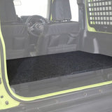 Front Runner Suzuki Jimny 3 Door (2018-Current) Rear Seat Base Deck in a green camp4x4 vehicle