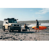 Front Runner Suzuki Jimny 3 Door (2018-Current) Slimline II Roof Rack / Tall, fitted to a Suzuki Jimny 3 Door, at the beach