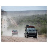 Front Runner Slimline II Roof Rack, mounted n a Suzuki Jimny 5 door, on a dirt road with other traffic