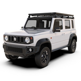 Front Runner Suzuki Jimny 5 Door (2023-Current) Slimline II Roof Rack - tall mounted on a white Suzuki Jimny 5 Door 4x4 vehicle